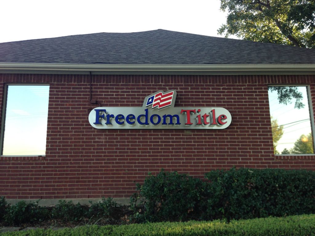 Commercial building sign of Freedom Title installed by Priority Signs & Graphics in Dallas Fort Worth