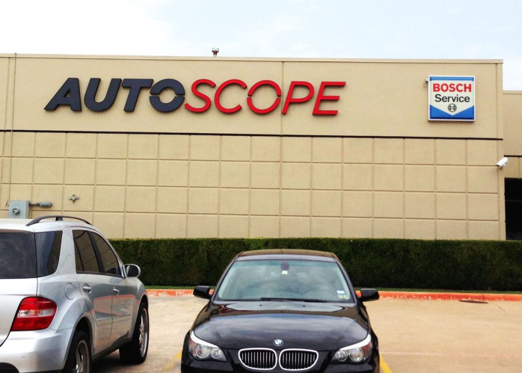 Dimensional letters on building for Auto Scope business installed by Priority Signs & Graphics in Dallas Fort Worth