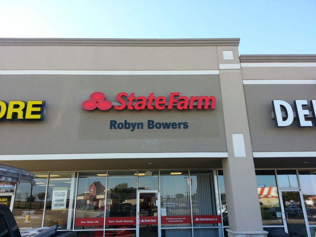 Business sign of State Farm installed on building by Priority Signs & Graphics in Dallas Fort Worth
