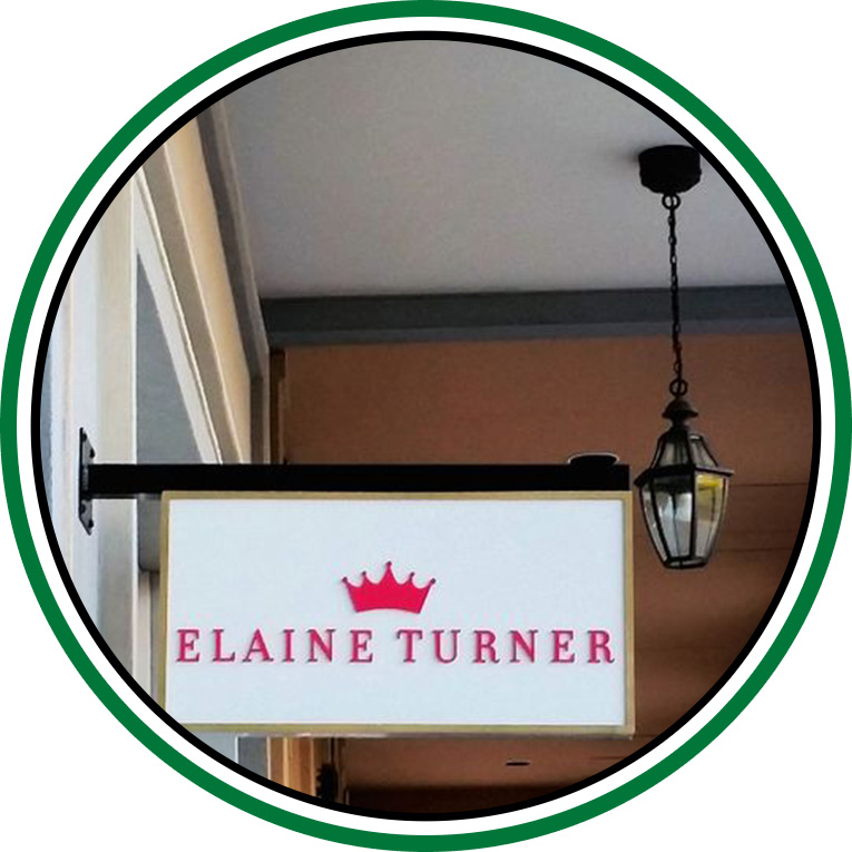 Hanging acrylic sign of Elaine Turner made by Priority Signs & Graphics in Dallas Fort Worth
