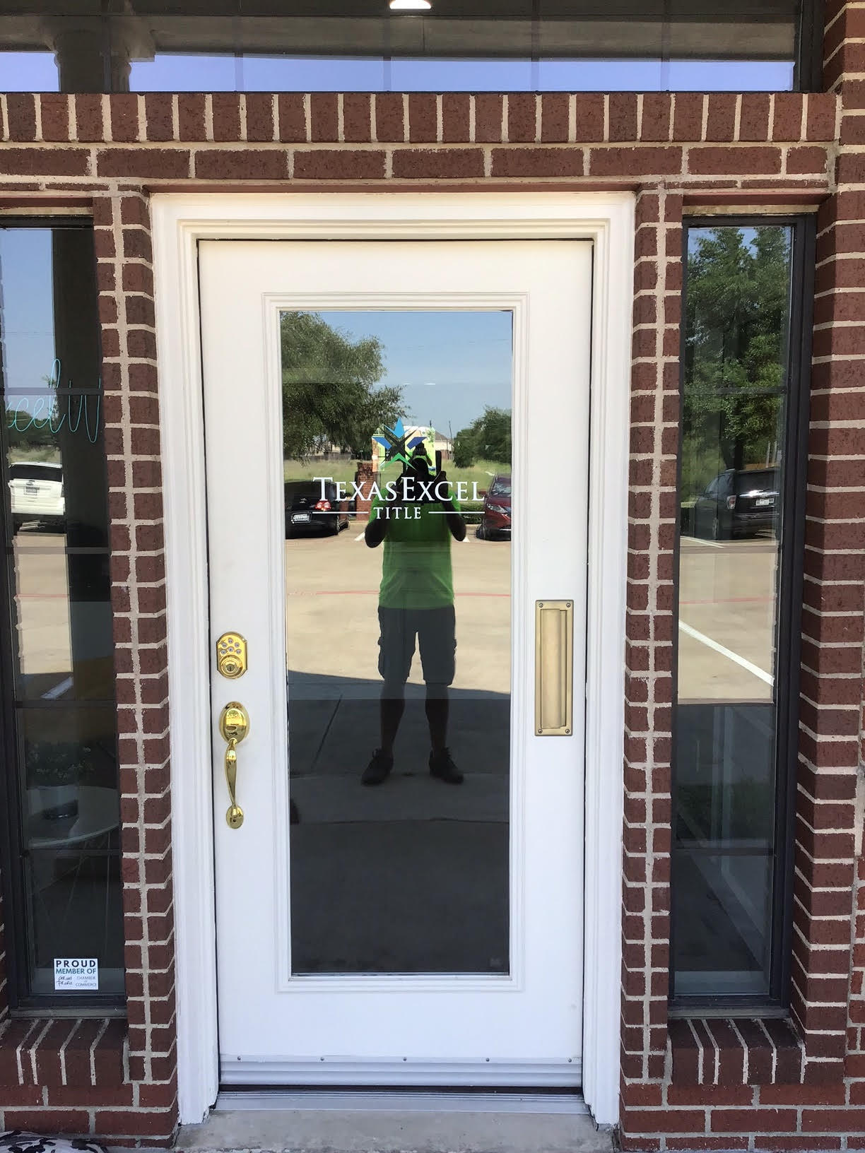 Vinyl sign of Texas Excel on door installed by Priority Signs & Graphics in Dallas, TX