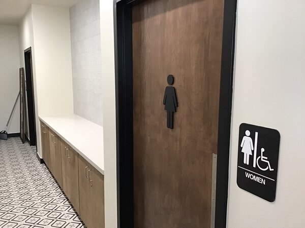 Custom bathroom signs made by Priority Signs & Graphics in Dallas, TX