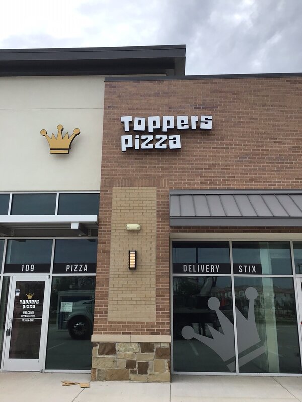 Storefront signs of Toppers Pizza made by Priority Signs & Graphics in Dallas Fort Worth, TX
