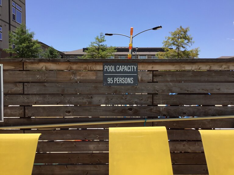 Pool capacity metal sign installed in Dallas