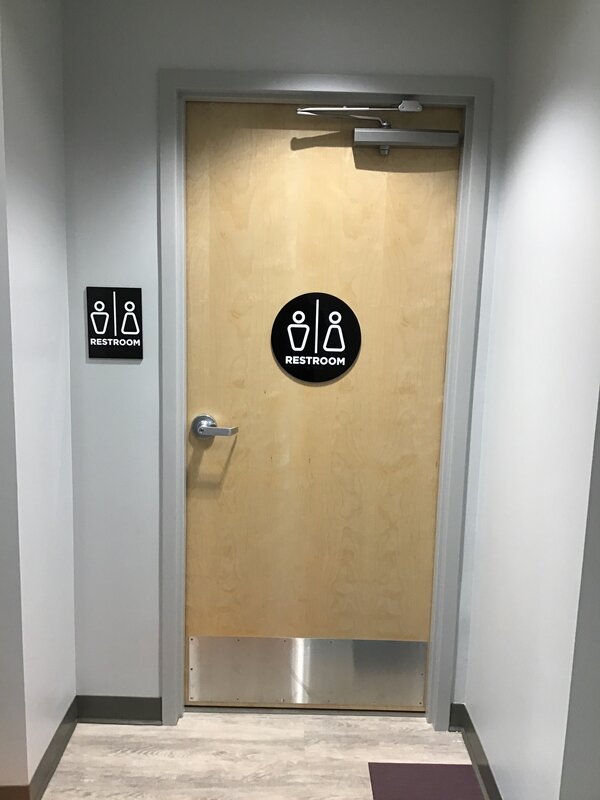 ADA restroom signs designed by Priority Signs & Graphics in Dallas, TX