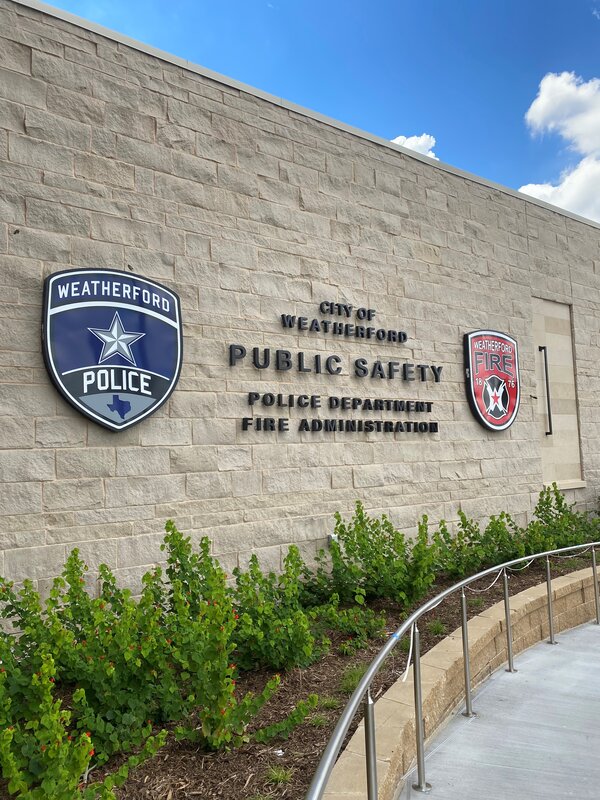 Storefront building signs of Weatherford Police