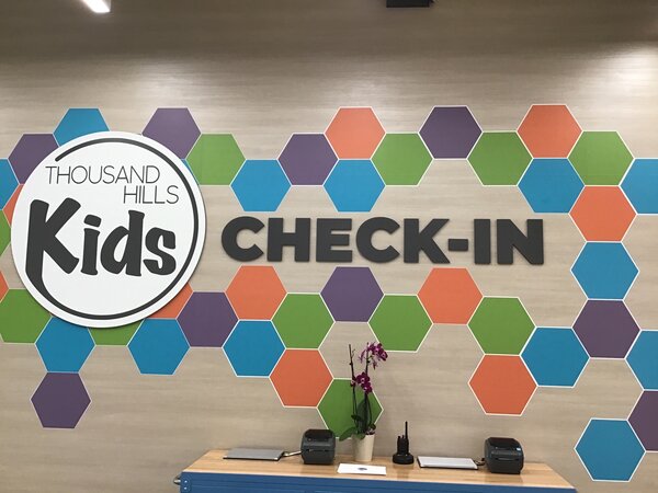 Vinyl lobby sign and logo for Kids printed in Dallas, TX
